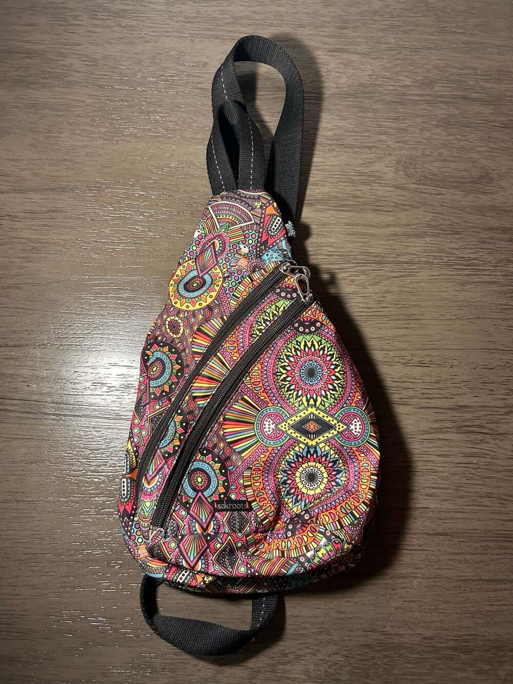 Sakroots On The Go Sling Backpack in Rainbow Wanderlust Pattern